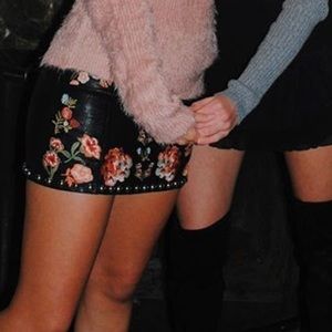 Signature eight black and floral leather skirt